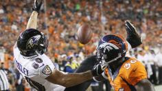 Denver Broncos cornerback Kayvon Webster (R) breaks up a pass to Baltimore Ravens Brandon Stokley in the endzone in the second quarter of their NFL football game in Denver September 5, 2013. 