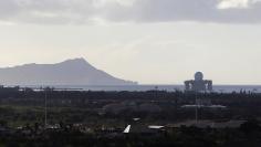 The U.S. Navy Sea based X Band radar leaves Pearl Harbor as a hurricane and a tropical storm approach the Hawaiian islands, in Honolulu