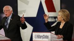 Democratic U.S. presidential candidates Clinton and Sanders discuss a point during the second official 2016 U.S. Democratic presidential candidates debate in Des Moines