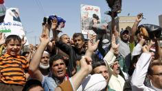 Supporters of prominent Iraqi Shi'ite cleric Moqtada al-Sadr shout slogans during a protest against government corruption after Friday prayers in Baghdad's Sadr City