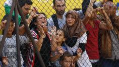 Migrants protest in front of the Bicske railway station in Bicske