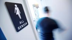 A bathroom sign welcomes both genders at the Cacao Cinnamon coffee shop in Durham, North Carolina