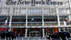 The motorcade of U.S. President-elect Donald Trump makes its way past the New York Times building after a meeting in New York 