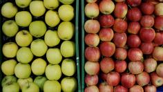 Apples are on display at a shop of a food market in Vienna
