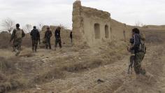 File photo of Afghan National Army (ANA) soldiers patrolling at an outpost in Helmand