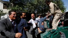 Men move an injured man to a hospital after a blast in Kabul, Afghanistan May 31, 2017. REUTERS/Mohammad Ismail   