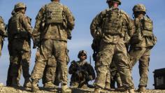FILE PHOTO: U.S. soldiers from Dragon Troop of the 3rd Cavalry Regiment discuss their mission during their first training exercise of the new year near operating base Gamberi in the Laghman province of Afghanistan January 1, 2015. REUTERS/Lucas Jackson 