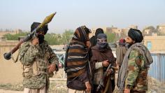 File picture of members of the Taliban at the site of the execution of three men accused of murdering a couple during a robbery in Ghazni Province