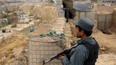 Afghan police officers keep watch at their forward base on the outskirts of Kunduz province, Afghanistan November 26, 2017. REUTERS/Nasir Wakif