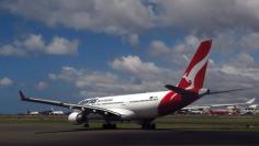 A Qantas Airways Airbus A330 aircraft can be seen on the tarmac near the domestic terminal at Sydney Airport