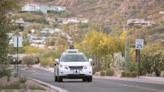 Test drivers use a Lexus SUV, built as a self-driving car, to map the area before a journey without a driver in control, in Phoenix