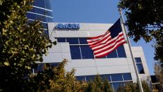 FILE PHOTO - An Amgen sign is seen at the company's office in South San Francisco, California October 21, 2013. REUTERS/Robert Galbraith/File Photo  