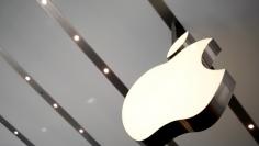 FILE PHOTO: The Apple logo is pictured inside the newly opened Omotesando Apple store at a shopping district in Tokyo June 26, 2014. REUTERS/Yuya Shino/File Photo