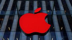 FILE PHOTO: An Apple logo hangs above the entrance to the Apple store on 5th Avenue in the Manhattan borough of New York City, U.S., December 5, 2016.  REUTERS/Brendan McDermid 
