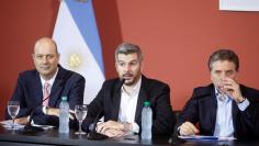 Argentina's Cabinet Chief Marcos Pena, accompanied by Minister of the Treasury Nicolas Dujovne and Argentine Central Bank Governor Federico Sturzenegger attend a news conference at the Casa Rosada Presidential Palace in Buenos Aires, Argentina December 2