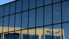 FILE PHOTO: The Google logo is shown reflected on an adjacent office building in Irvine, California, U.S. August 7, 2017.   REUTERS/Mike Blake/File Photo