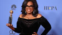 75th Golden Globe Awards – Photo Room – Beverly Hills, California, U.S., 07/01/2018 – Oprah Winfrey poses backstage with her Cecil B. DeMille Award. REUTERS/Lucy Nicholson