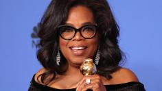 75th Golden Globe Awards – Photo Room – Beverly Hills, California, U.S., 07/01/2018 – Oprah Winfrey poses backstage with her Cecil B. DeMille Award. REUTERS/Lucy Nicholson