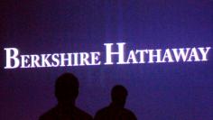 FILE PHOTO: Berkshire Hathaway shareholders walk by a video screen at the company's annual meeting in Omaha, Nebraska, U.S., May 4, 2013.  REUTERS/Rick Wilking/File Photo 