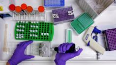 FILE PHOTO: Scientist prepares protein samples for analysis in a lab at the Institute of Cancer Research in Sutton, Britain.