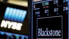 FILE PHOTO --  The ticker and trading information for Blackstone Group is displayed at the post where it is traded on the floor of the New York Stock Exchange (NYSE) April 4, 2016. REUTERS/Brendan McDermid/File Photo 