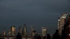 FILE PHOTO: The late winter light shines on the buildings in the City of London financial district of London