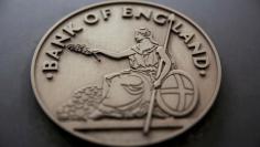 FILE PHOTO: FILE PHOTO: A sign is displayed outside the Bank of England in London, Britain August 4, 2016.   REUTERS/Neil Hall/File Photo/File Photo 