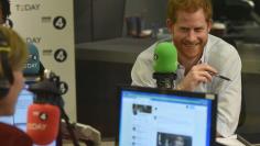 Britain's Prince Harry reacts as he guest edits the BBC's Radio 4 Today programme, in London