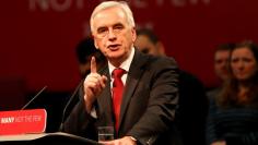 FILE PHOTO - Britain's Shadow Finance Minister John McDonnell speaks at the Labour Party Post-Budget Rally in West Bromwich, Britain, November 23, 2017. REUTERS/Darren Staples