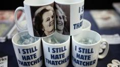 Novelty mugs bearing a photograph of former British Prime Minister Margaret Thatcher are displayed for sale on a stand at the Trades Union Congress (TUC) in Liverpool, northern England September 9, 2014. REUTERS/Phil Noble 