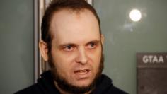 FILE PHOTO: Joshua Boyle speaks to the media after arriving with his wife and three children at Toronto Pearson International Airport