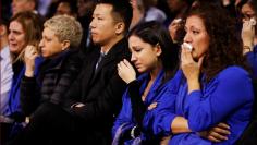 A woman cries during a memorial service for Apotex pharmaceutical billionaire Barry Sherman and his wife Honey, days after what police call their suspicious deaths in Toronto, Ontario, Canada, December 21, 2017.  REUTERS/Mark Blinch