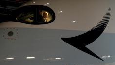 FILE PHOTO: Pilots look out from the cockpit of a Cathay Pacific Airways Airbus A350 as the airlines hold a ceremony to mark the first of their 48 Airbus A350 arriving at Hong Kong Airport, Hong Kong, China May 30, 2016. REUTERS/Bobby Yip/File Photo