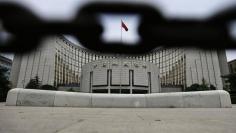 The headquarters of China's central bank, the People's Bank of China, is pictured behind an iron chain in Beijing, June 21, 2013.   REUTERS/Jason Lee 