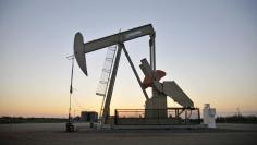 A pump jack operates at a well site leased by Devon Energy Production Company near Guthrie, Oklahoma September 15, 2015. REUTERS/Nick Oxford 