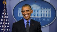 Obama smiles as he holds his end of the year news conference at the White House in Washington