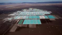 An aerial view shows the brine pools of SQM lithium mine on the Atacama salt flat in the Atacama desert of northern Chile,