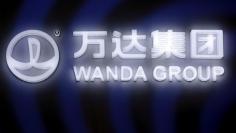 A sign of Dalian Wanda Group in China glows during an event announcing strategic partnership between Wanda Group and FIFA in Beijing, China March 21, 2016. REUTERS/Damir Sagolj