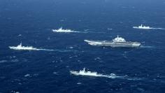 FILE PHOTO: China's Liaoning aircraft carrier with accompanying fleet conducts a drill in an area of South China Sea