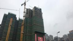 Buildings under construction are pictured in Chengdu, Sichuan province, China November 12, 2017. Picture taken November 12, 2017. REUTERS/Yawen Chen