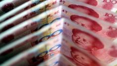 One-hundred Yuan notes are seen in this picture illustration in Beijing March 22, 2011. REUTERS/Jason Lee