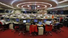 Floor traders work during afternoon trading at the Hong Kong Stock Exchange November 6, 2013.   REUTERS/Bobby Yip   