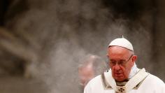 Pope Francis celebrates during the traditional midnight Mass in St. Peter's Basilica on Christmas Eve at the Vatican December 24, 2017. REUTERS/Tony Gentile