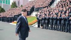 North Korean leader Kim Jong Un has a photo session with the participants in the Seventh Congress of the WPK