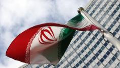 An Iranian flag flutters in front of the United Nations headquarters, during an IAEA board of governors meeting, in Vienna