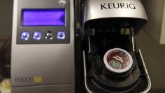 FILE PHOTO - A single-serve Keurig Green Mountain brewing machine is seen before dispensing coffee in New York February 6, 2015. REUTERS/Shannon Stapleton