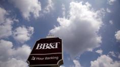 A BB&T bank branch sign is seen in Arlington, Virginia, August 14, 2009. The Federal Deposit Insurance Corp is taking Colonial BancGroup Inc. into receivership and will sell the struggling lender's branches and deposits to BB&T. REUTERS/Jim Young    (UNIT