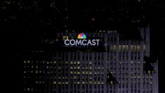 FILE PHOTO: The NBC and Comcast logo are displayed on top of 30 Rockefeller Plaza, formerly known as the GE building, in midtown Manhattan in New York July 1, 2015.   REUTERS/Brendan McDermid/File Photo        