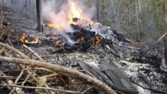 Smoke and fire seen at the site where a plane crashed in the mountainous area of Punta Islita, in the province of Guanacaste, in Costa Rica December 31, 2017 in this picture obtained from social media.  Ministerio de Seguridad Publica de Costa Rica/via R