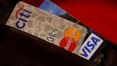 Credit cards are pictured in a wallet in Washington, February 21, 2010. REUTERS/Stelios Varias 